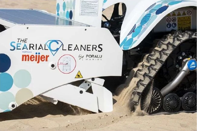 Close-up of the robot's tracks and sifter lifting and filtering beach sand